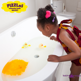 bath bombs, fizzles, orange fizzle bath with girl admiring
