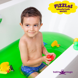 bath bombs, fizzles, green fizzle bath with boy playing