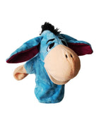 A blue hand puppet of a furry animal character with a human-like face and mouth.