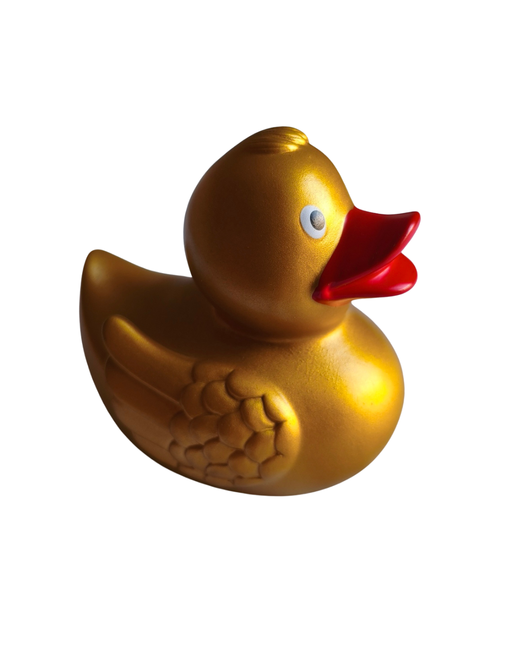 Gold rubber duck with a red beak on a white background