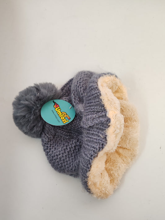 Grey beanie with inner fur lining.