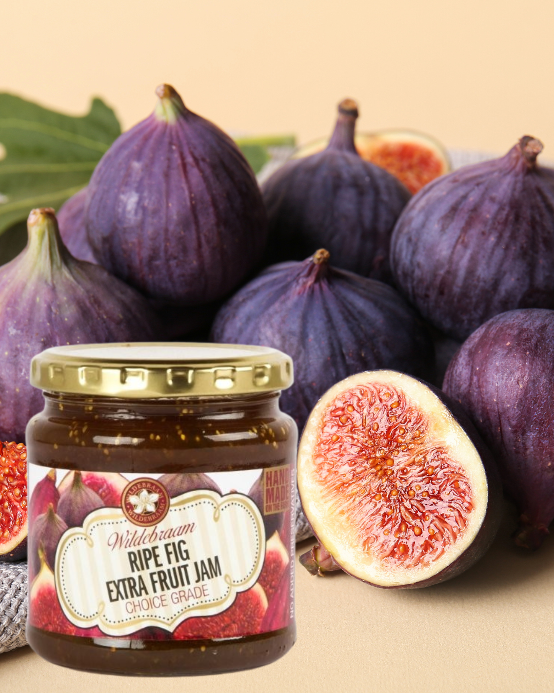 Jar of Wildbream Ripe Fig Extra Fruit Jam with fresh figs on a beige background