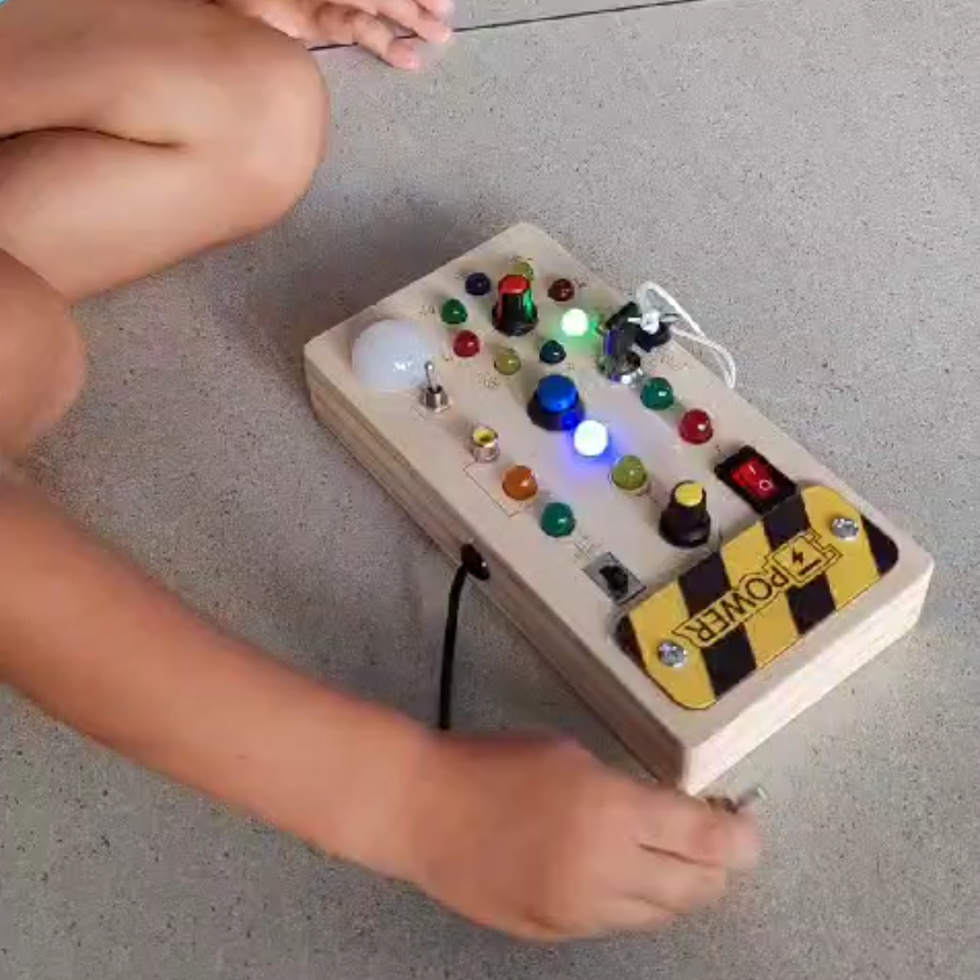 Kid playing with Busy Board