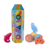 Colorful toy packaging with bath bombs and animal-shaped tools on a white background