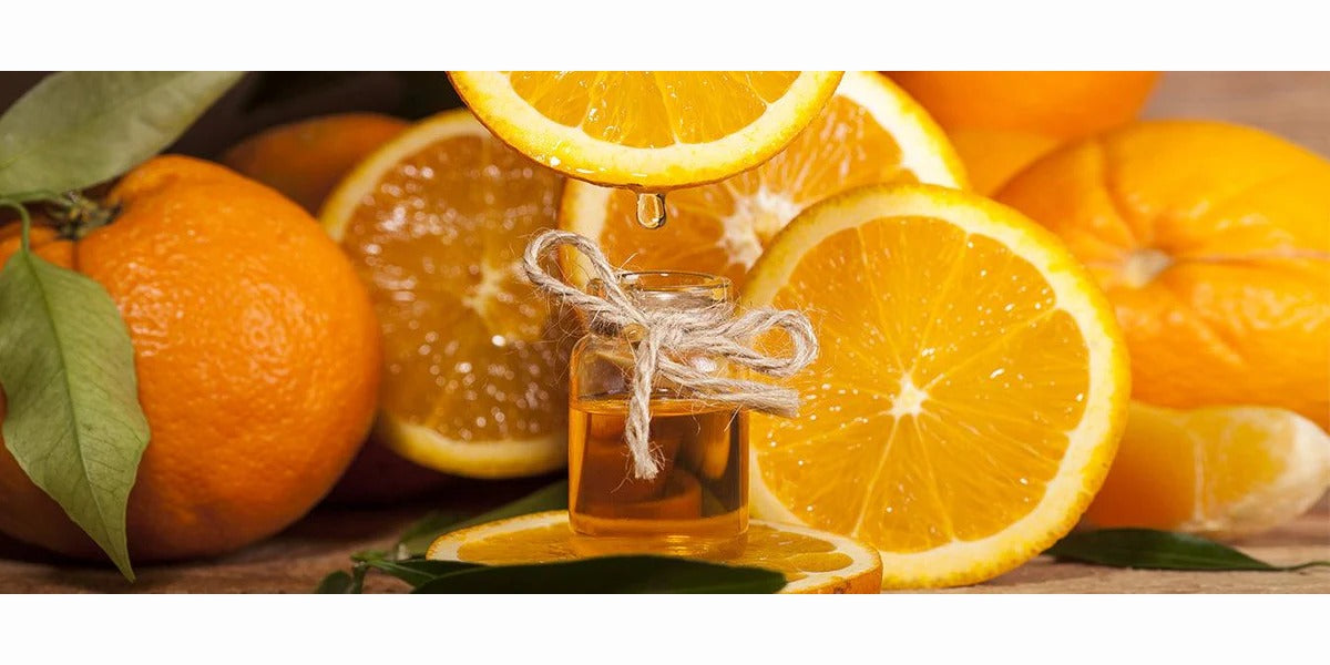 image of sweet oranges and essential oil of sweet orange
